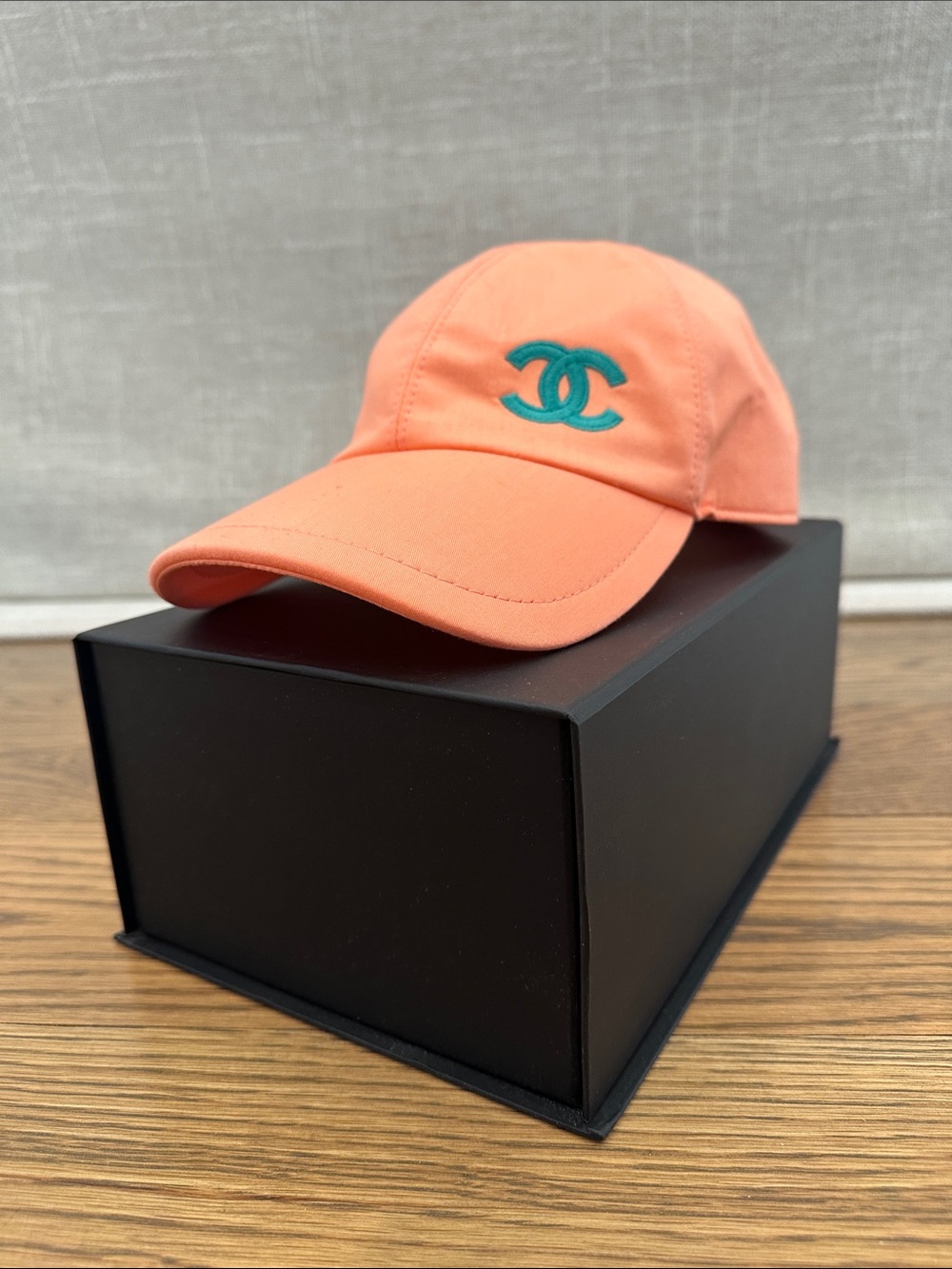 CHANEL Coral-Orange Cap with Teal Double C Logo